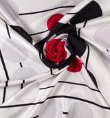 DWAEP Polka and Pop silk twill scarf shown in a draped close-up
